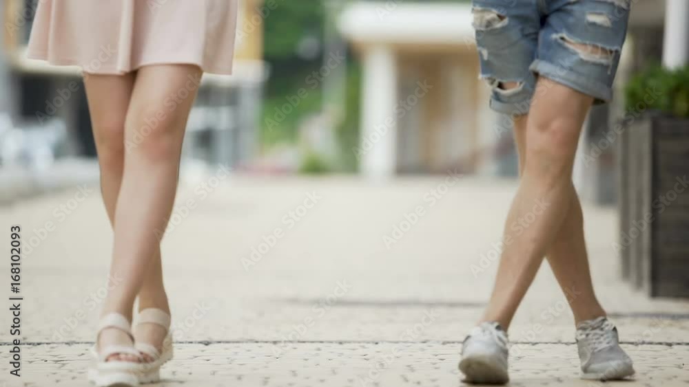 Man and woman walking simultaneously in funny way, as if dancing, happy mood Man and woman walking simultaneously in funny way, as if dancing, happy mood