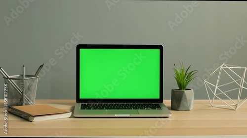 Wallpaper Mural Close up shot of laptop with green screen on the light wooden table. Chroma key. Torontodigital.ca