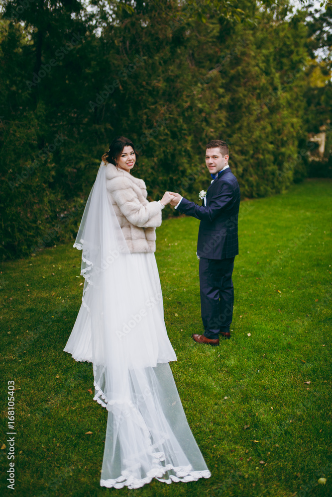 Beautiful bride and groom couple walking at the wedding Beautiful bride and groom couple walking at the wedding