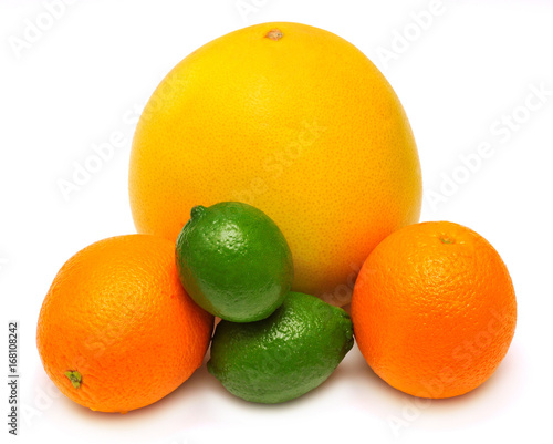 Assorted tropical fruit lime  orange and pomelo isolated on white background. Yellow  orange and green. A healthy and nutritious food for health after training in sports for burning fat