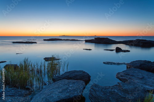 Glowing sea horizon during sunrise. The Island of Gotland in the Baltic Sea.