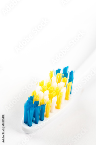 Closeup macro toothbrush isolated over white background with copy space