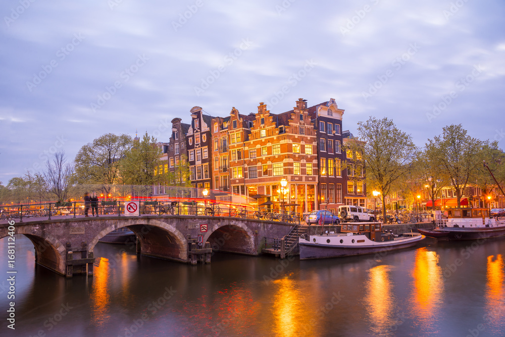 Fototapeta premium One of the famous canal of Amsterdam, the Netherlands at dusk