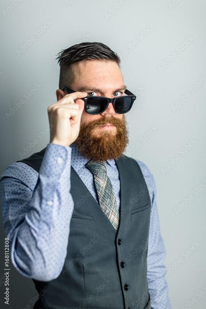 man looks over top of sunglasses man looks over top of sunglasses