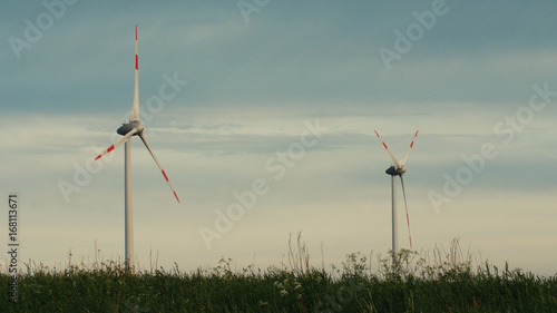 Wind turbines in the field, overcast. Clean and Renewable Energy, Wind Power, Turbine, Windmill, Energy Production