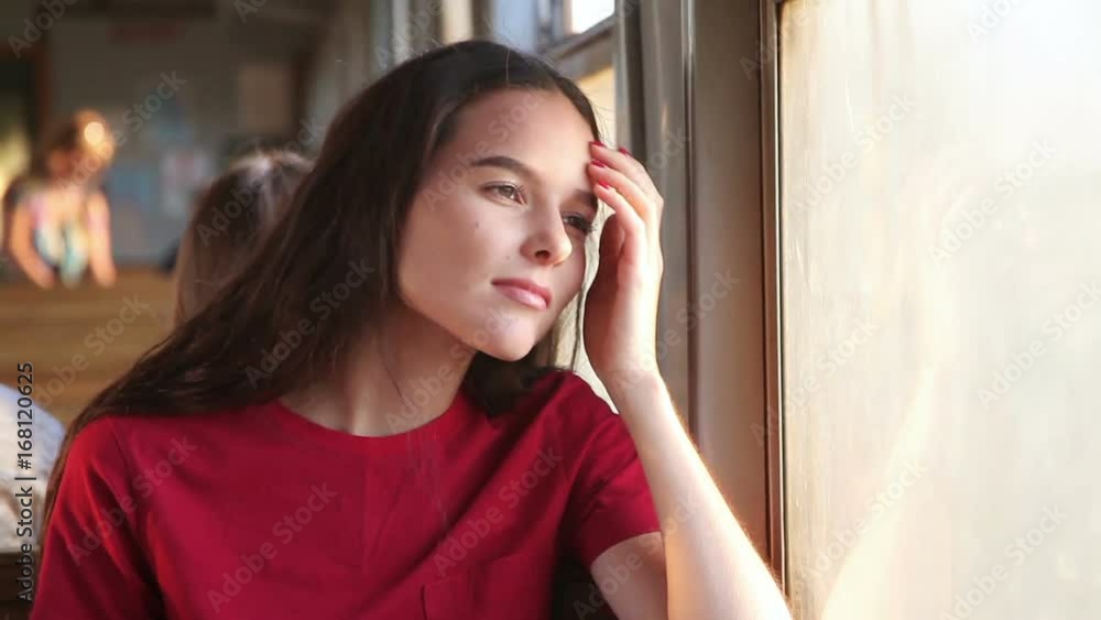 The girl near the train car window
