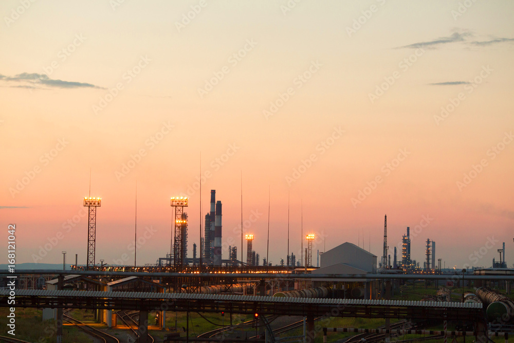 Industrial plant in the evening against the sunset