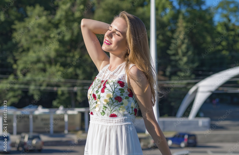 Beautiful girl enjoys sunlight