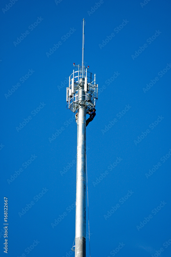 workers on a telecommunication tower
