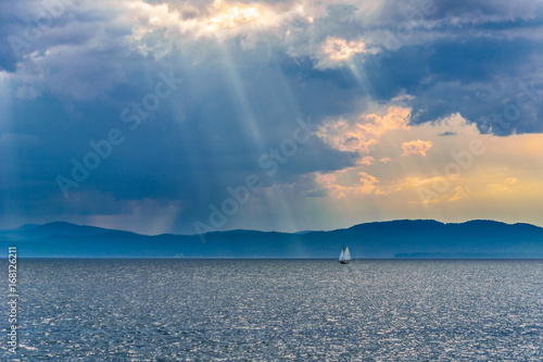 Boat on Lake Champlain under storm clouds