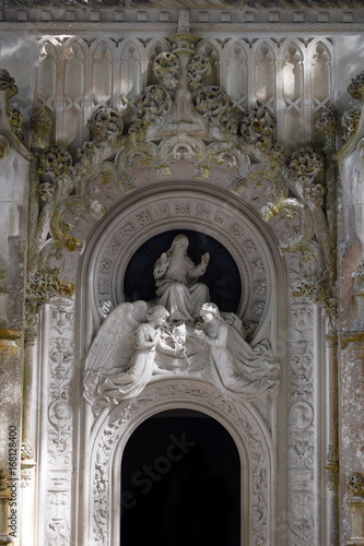 Detail in the park - old stone statue with angels, Quinta da Regaleira in Sintra, Portugal. © lemonspeed