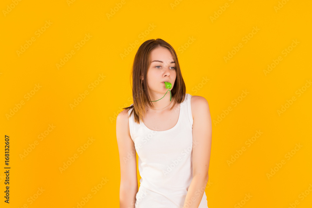 Young cute girl with whistle, studio Young cute girl with whistle, studio