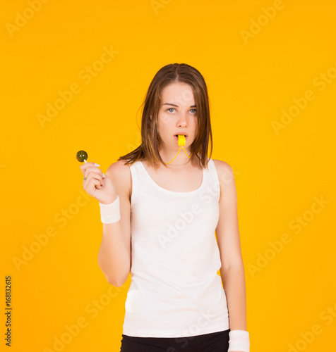 Young cute girl with whistle, studio  