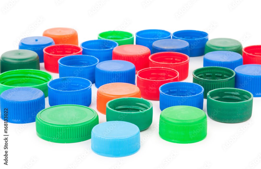 Plastic bottle caps on white background Plastic bottle caps on white background