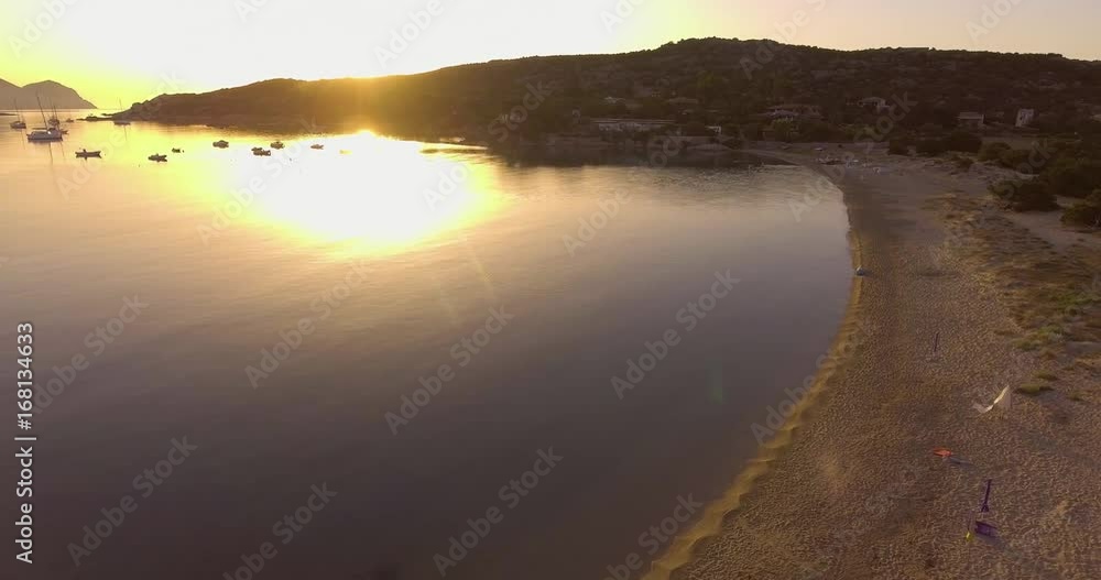 Aerial, beautiful empty beach in a bay in Sardinia island on sunrise Aerial, beautiful empty beach in a bay in Sardinia island on sunrise
