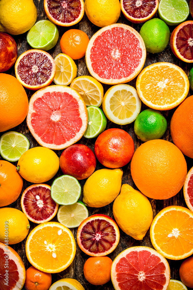 Naklejka Citrus background. Fresh citrus fruits - Lemons, oranges, limes, grapefruits.