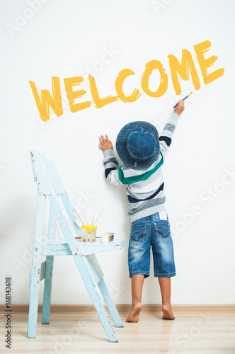 Happy child paints with paint.