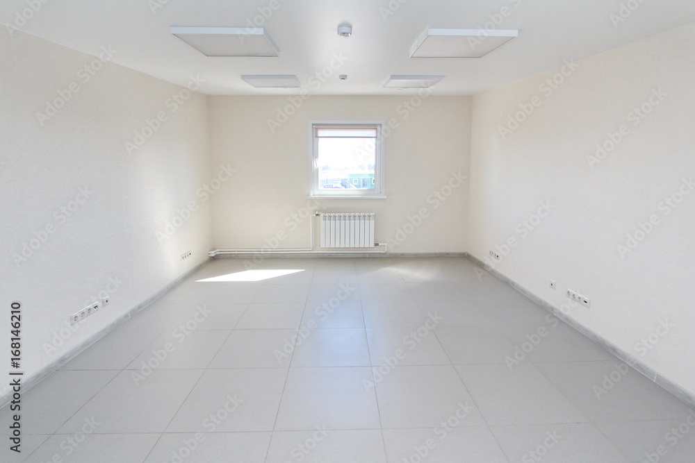 Fototapeta premium Interior empty office light room with white wallpaper unfurnished in a new building