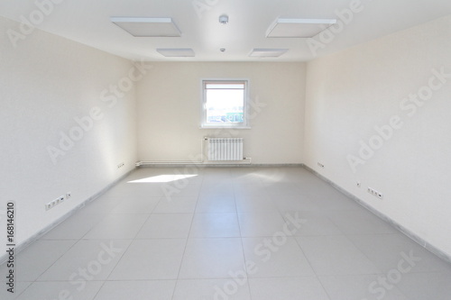 Interior empty office light room with white wallpaper unfurnished in a new building