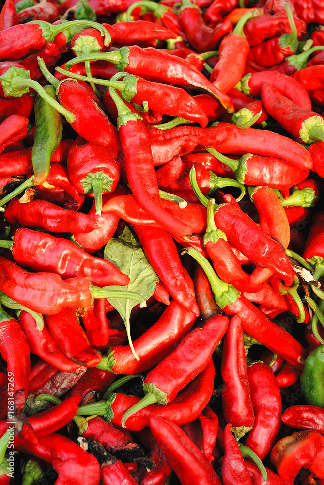Full Frame Shot Of Red Peppers. Background texture of hot red pepper. Red chili, seasoning paprika.