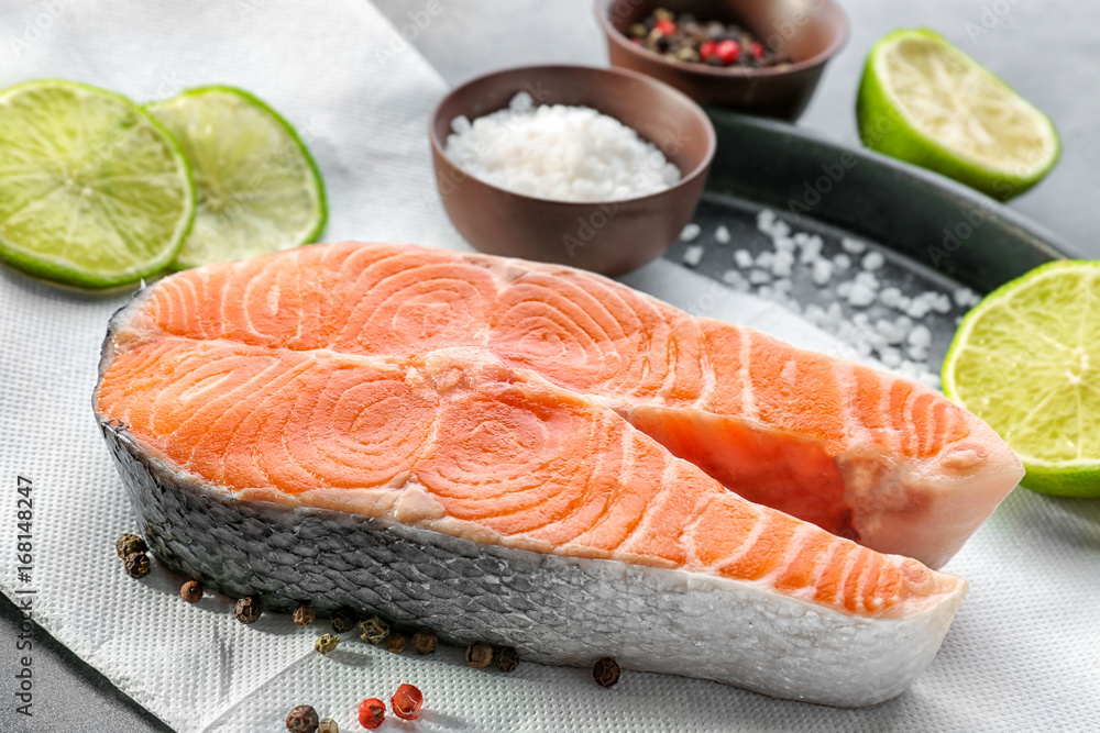 Baking dish with fresh salmon steak and spice, closeup Baking dish with fresh salmon steak and spice, closeup