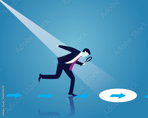 Businessman Looking Trough Magnifying Glass