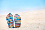 Flip-flops on sea beach. Summer vacation concept