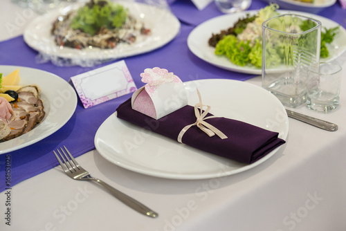 Served banquet table in white and purple colours