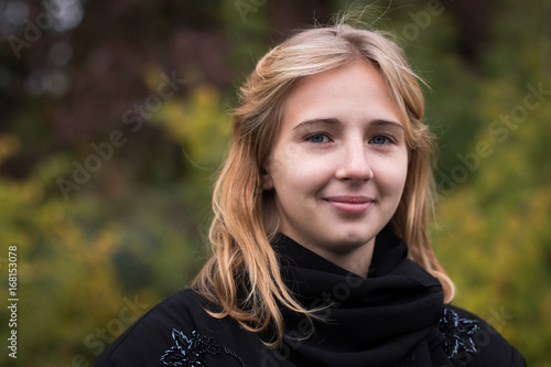 Nice girl outdoor in an autumn day