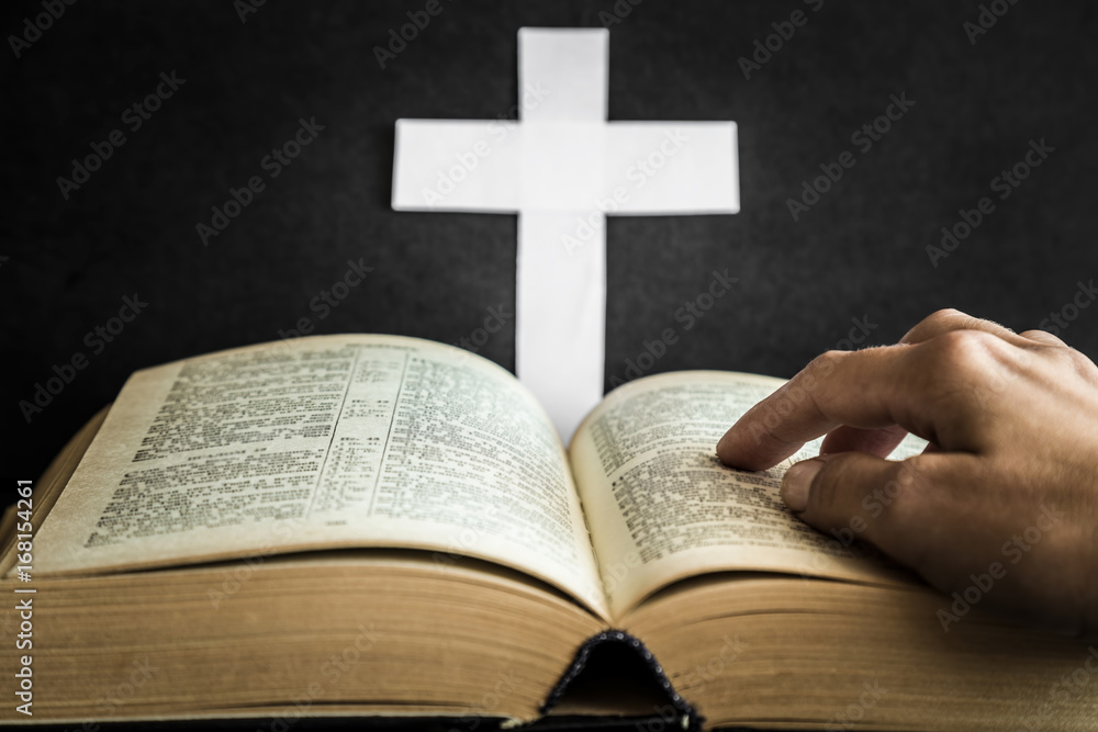 Opened bible in the quiet, dark atmosphere. Prayer time on sunday. Opened bible in the quiet, dark atmosphere. Prayer time on sunday.