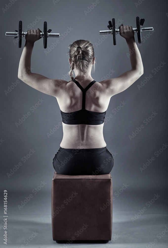 Woman doing shoulder workout Woman doing shoulder workout