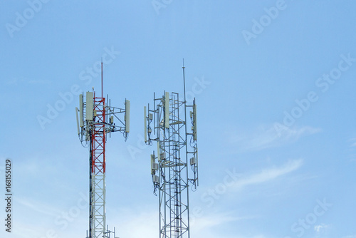 Mobile phone communication two tower transmission signal with blue sky background