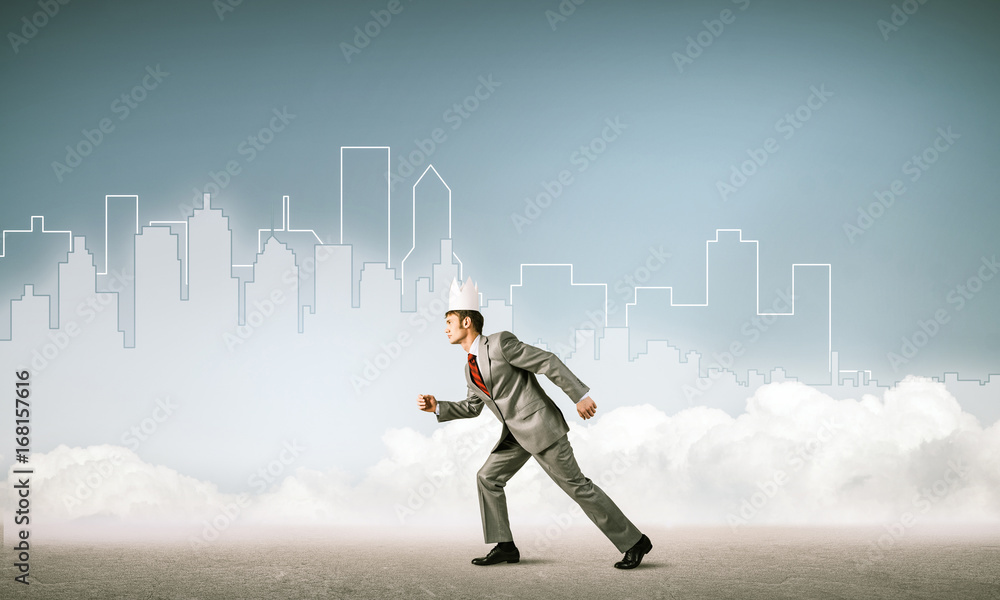 King businessman in elegant suit running and blue cityscape silh King businessman in elegant suit running and blue cityscape silh