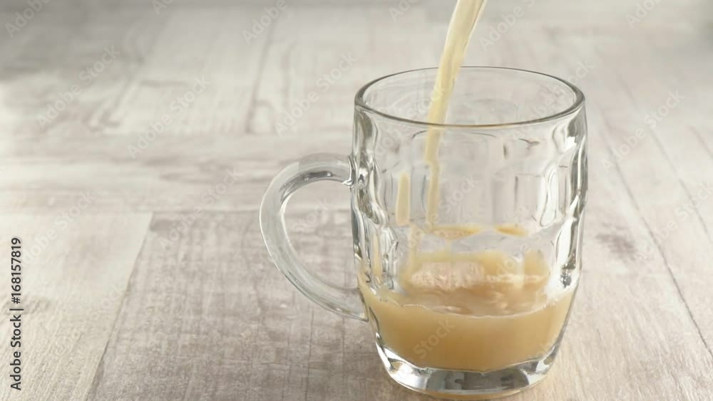 beer poured into a mug beer poured into a mug
