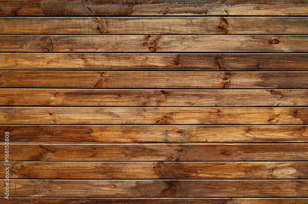 Fototapeta premium Background of natural knotted wood fence. Wooden texture.