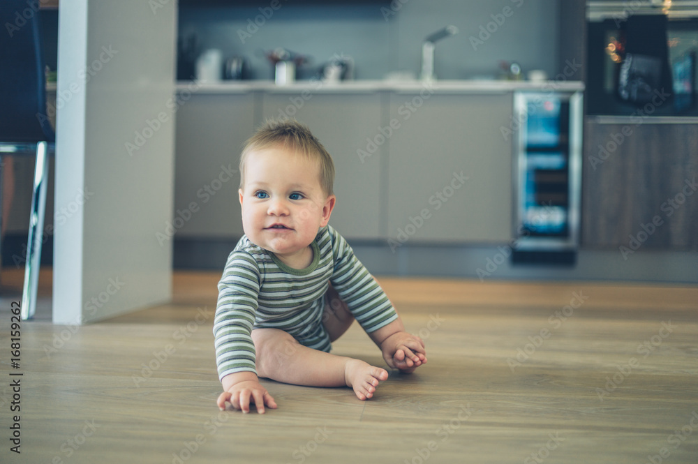 Little baby on kitchen floor Little baby on kitchen floor