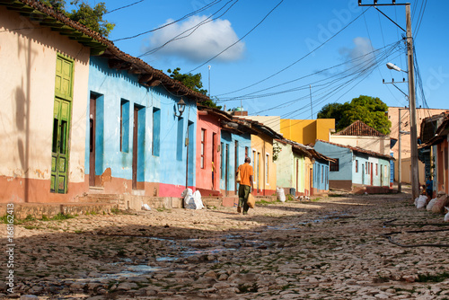 Trinidad, Cuba. Colorful houses facing on a cobblestone street at sunset © Marco