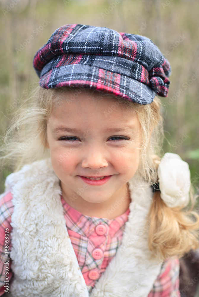 Portrait of a cute cheerful little girl on a nature. Portrait of a cute cheerful little girl on a nature.
