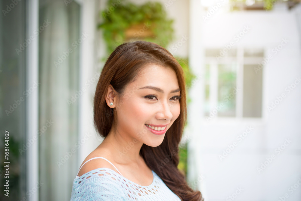 Carefree. Woman relaxing on balcony at home Carefree. Woman relaxing on balcony at home