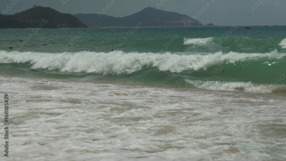 Strong waves at South China Sea on Dadonghai Beach slow motion stock footage video Strong waves at South China Sea on Dadonghai Beach slow motion stock footage video