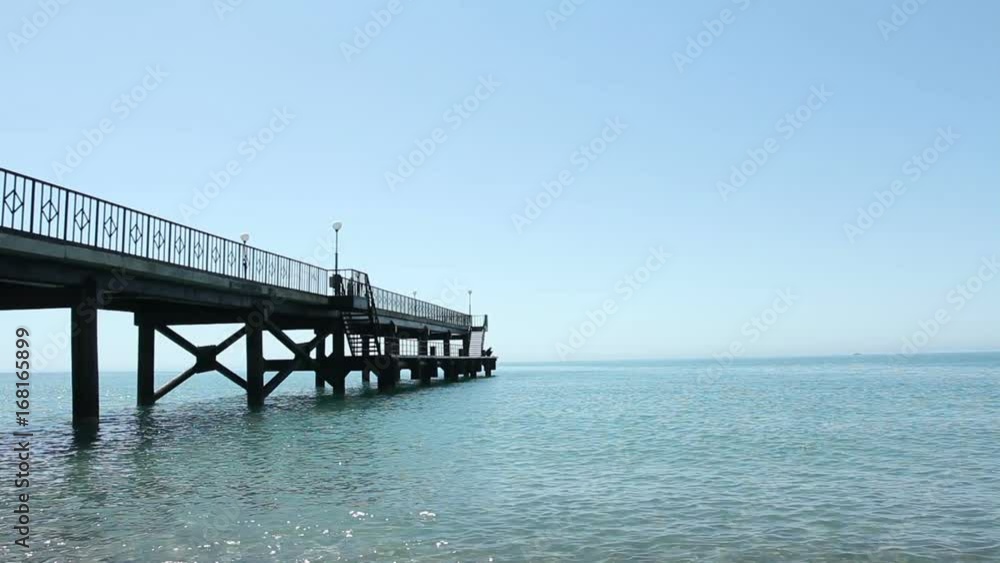 Metall pontoon stretching into the sea Metall pontoon stretching into the sea