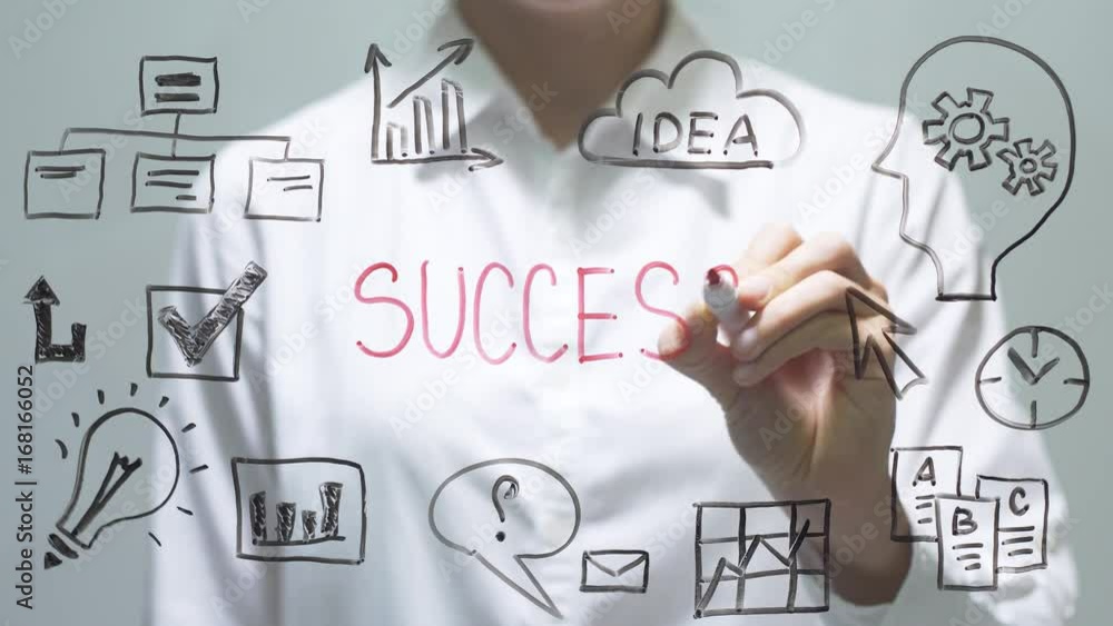 Woman writing SUCCESS on transparent screen. Businesswoman write on board Woman writing SUCCESS on transparent screen. Businesswoman write on board
