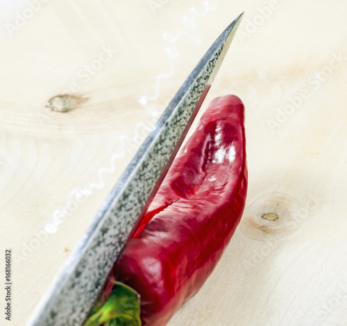 Hot pepper, chili peppers, capsicum, kinfe photo