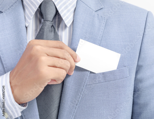 businessman showing white empty card