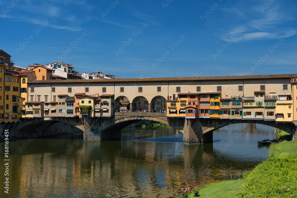 River Arno and famous bridge Ponte Vecchio (The Old Bridge) at sunny summer day. Florence, Tuscany, Italy River Arno and famous bridge Ponte Vecchio (The Old Bridge) at sunny summer day. Florence, Tuscany, Italy