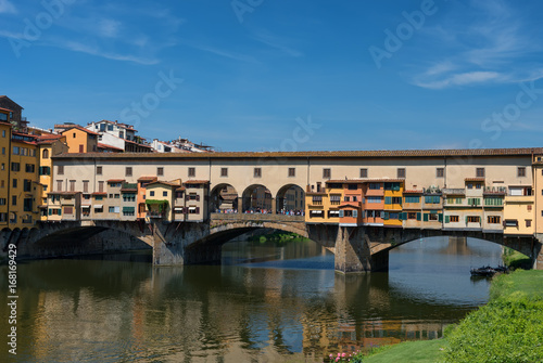 River Arno and famous bridge Ponte Vecchio  The Old Bridge  at sunny summer day. Florence  Tuscany  Italy
