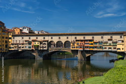 River Arno and famous bridge Ponte Vecchio  The Old Bridge  at sunny summer day. Florence  Tuscany  Italy