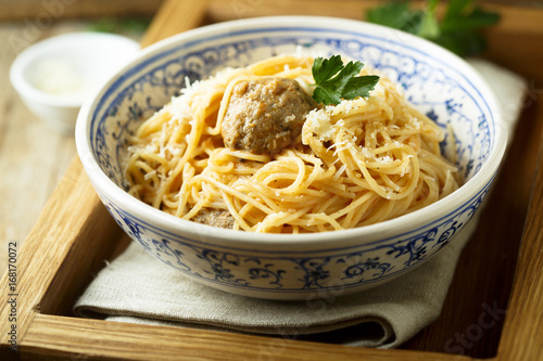 Spaghetti with meatballs, cheese and tomato sauce