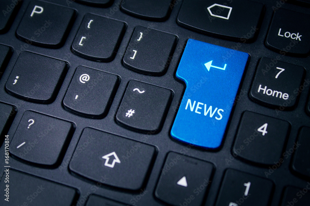 News text on computer keyboard. News text on computer keyboard.