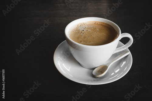 Capuccino, mocha, latte,americano, espresso hot coffee aroma in cup breakfast morning drink on wooden table vintage bar windows in cafe shop with newspaper restaurant background,copy space the left.
